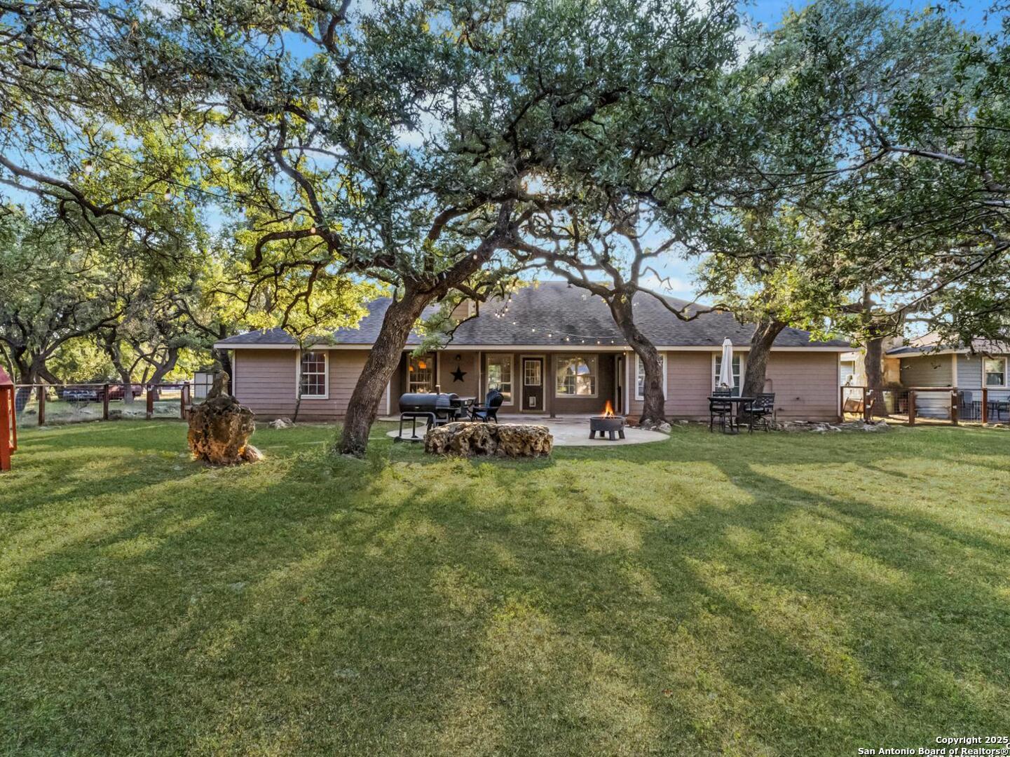 604 Guadalupe Drive Spring Branch, TX 78070 - Photo 39 of 54 a front view of a house with a garden