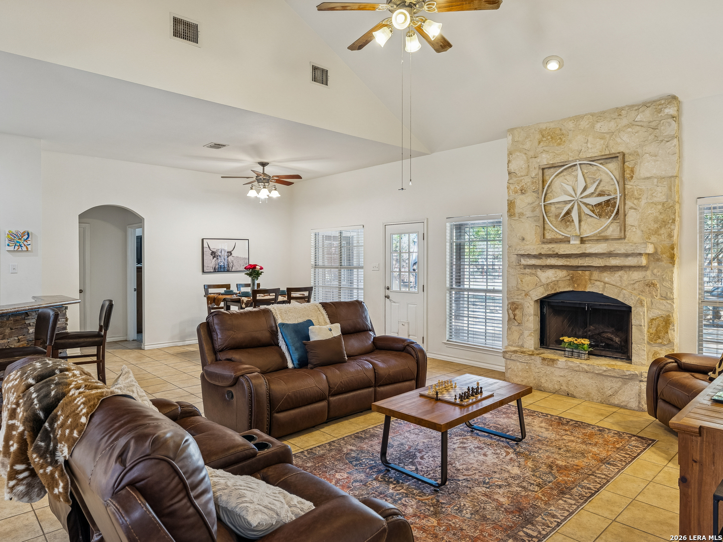 604 Guadalupe Drive Spring Branch, TX 78070 - Photo 10 of 54 a living room with furniture a chandelier and a fireplace