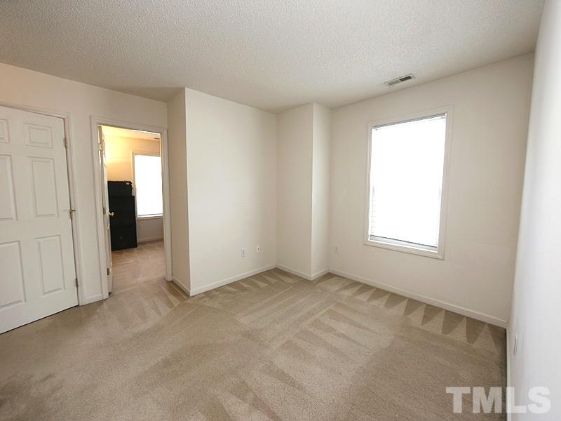 4205 Toccopola Street Raleigh, NC 27604 - Photo 15 of 24 an empty room with a window