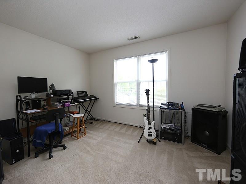 4205 Toccopola Street Raleigh, NC 27604 - Photo 18 of 24 a view of a workspace with furniture and a window