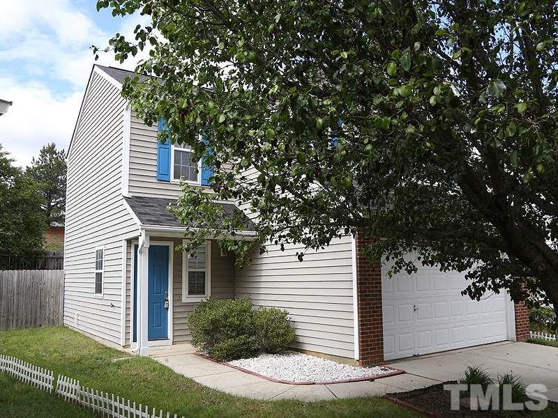 4205 Toccopola Street Raleigh, NC 27604 - Photo 23 of 24 a front view of a house with a tree