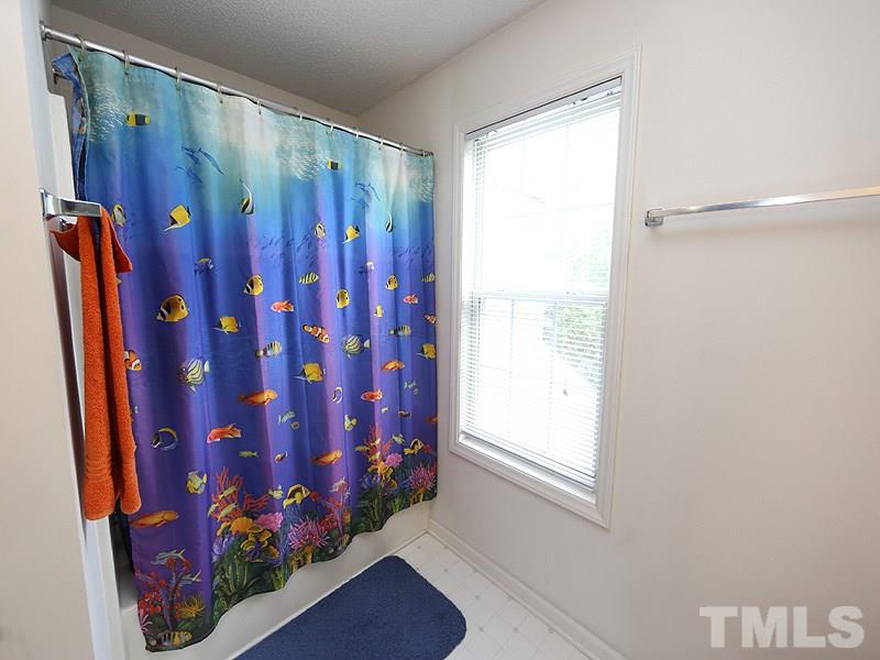 4205 Toccopola Street Raleigh, NC 27604 - Photo 7 of 24 a view of a entryway with flower and a shower