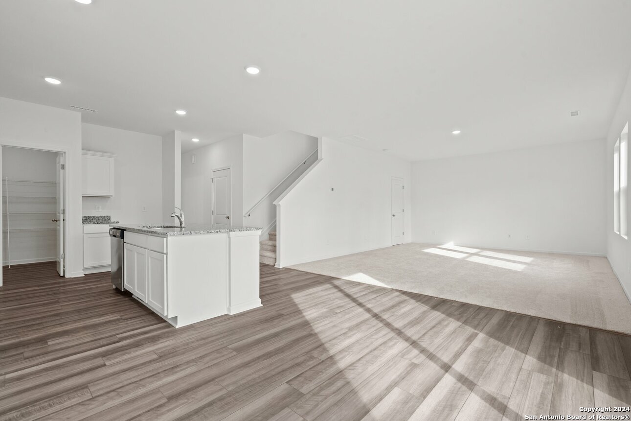 1428 Almeda Road Seguin, TX 78155 - Photo 11 of 17 a view of kitchen with cabinets and wooden floor