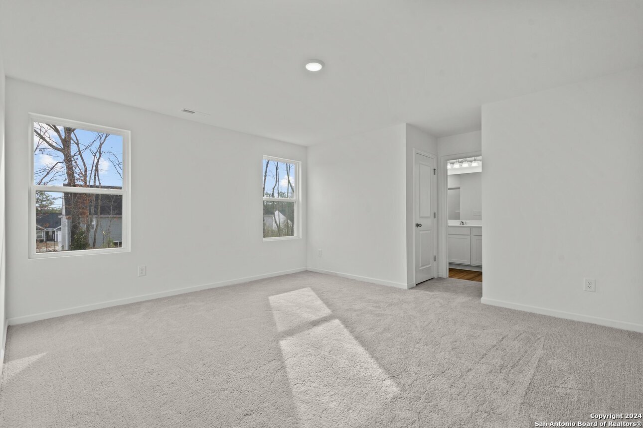 1428 Almeda Road Seguin, TX 78155 - Photo 16 of 17 an empty room with windows and closet