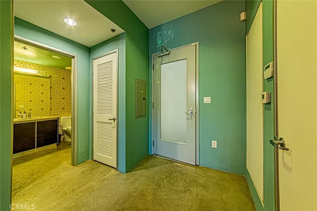 a view of an empty room with a bathroom
