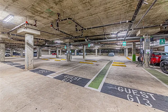 a view of parking garage with cars