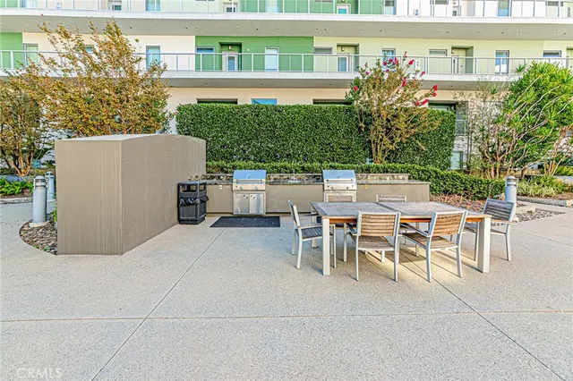 a view of yard with swimming pool and seating area