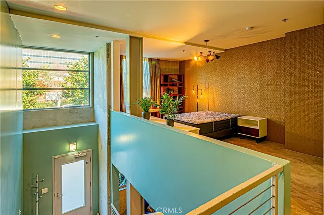 a room with pool table and large window