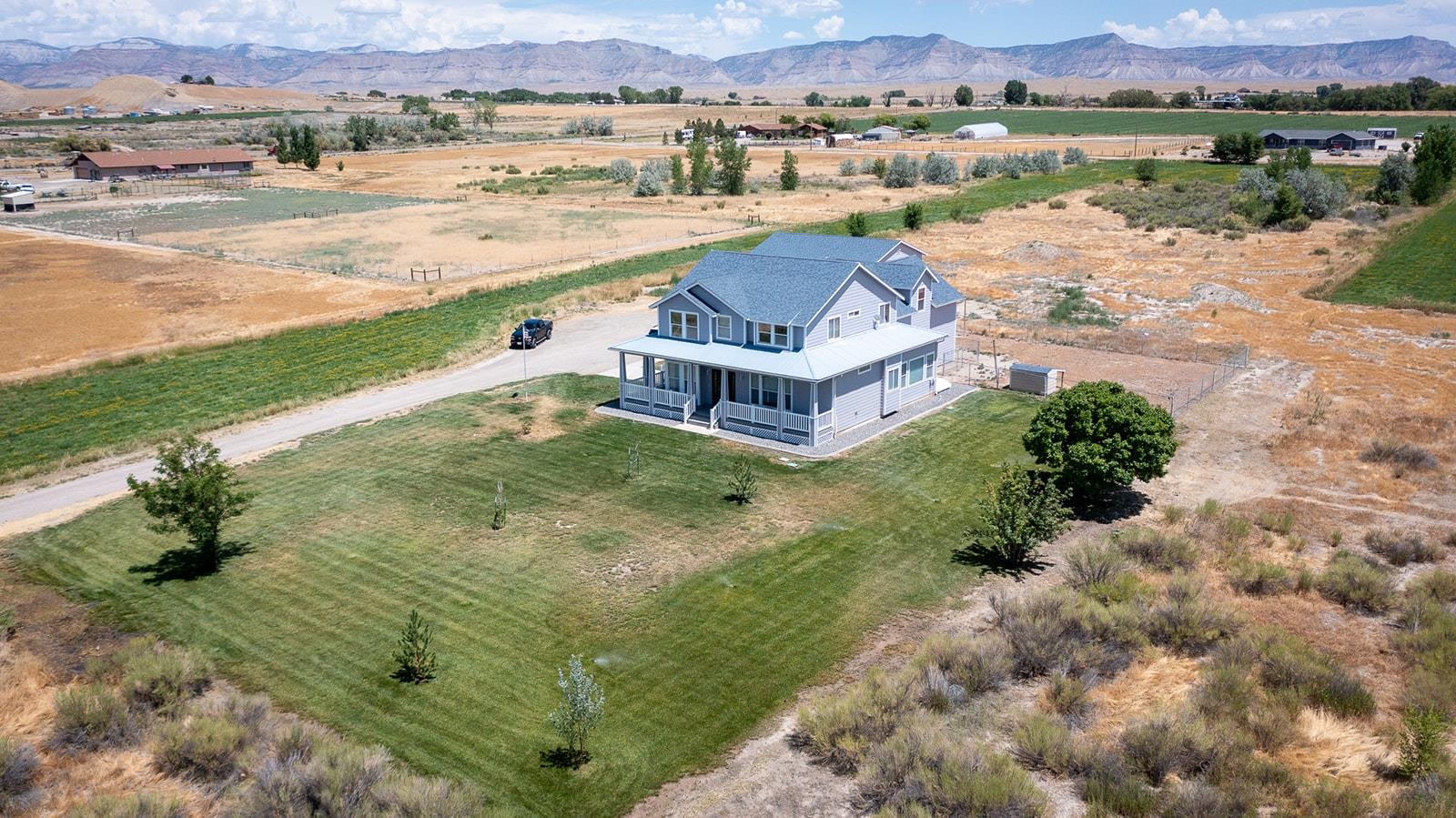 1815 O Road Fruita, CO 81521 - Photo 11 of 42 an aerial view of a house with a lake view