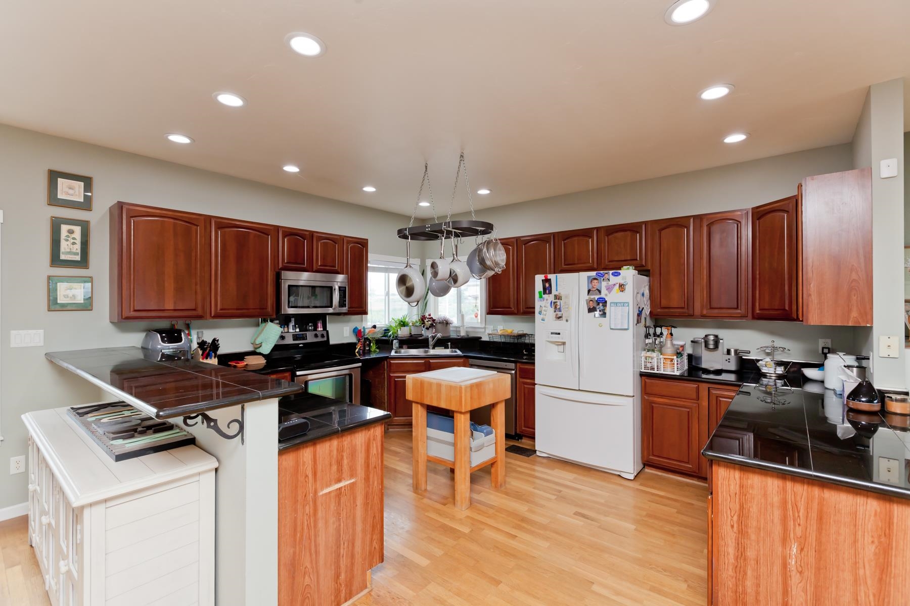 1815 O Road Fruita, CO 81521 - Photo 16 of 42 a kitchen with stainless steel appliances granite countertop a refrigerator stove microwave and sink