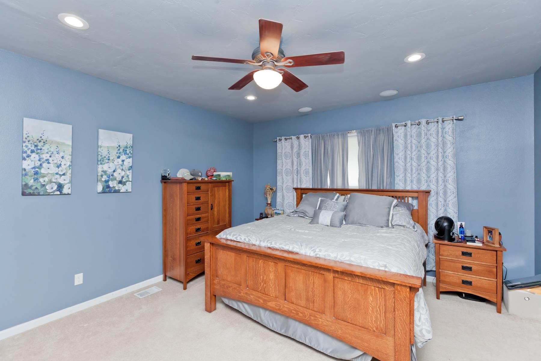 1815 O Road Fruita, CO 81521 - Photo 24 of 42 a bed room with a bed and a chandelier