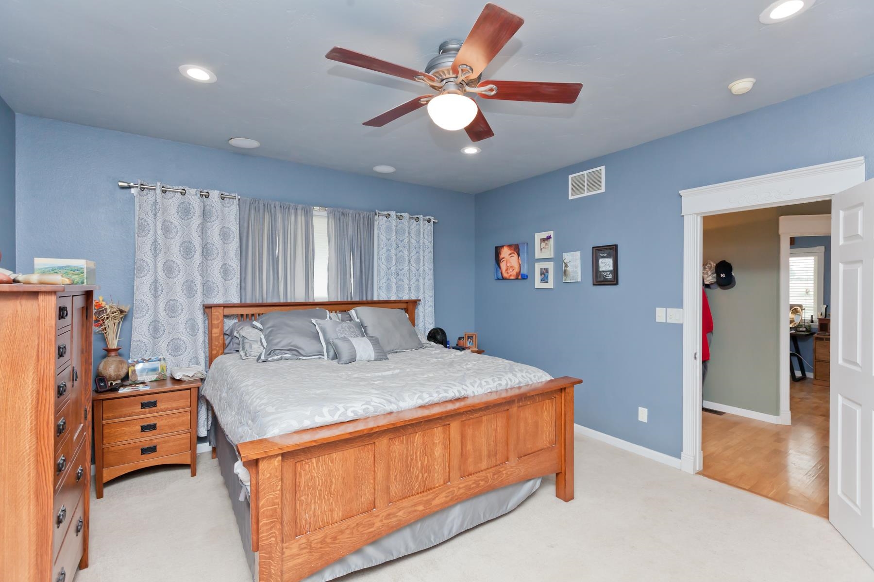 1815 O Road Fruita, CO 81521 - Photo 26 of 42 a bedroom with a large bed and a chandelier