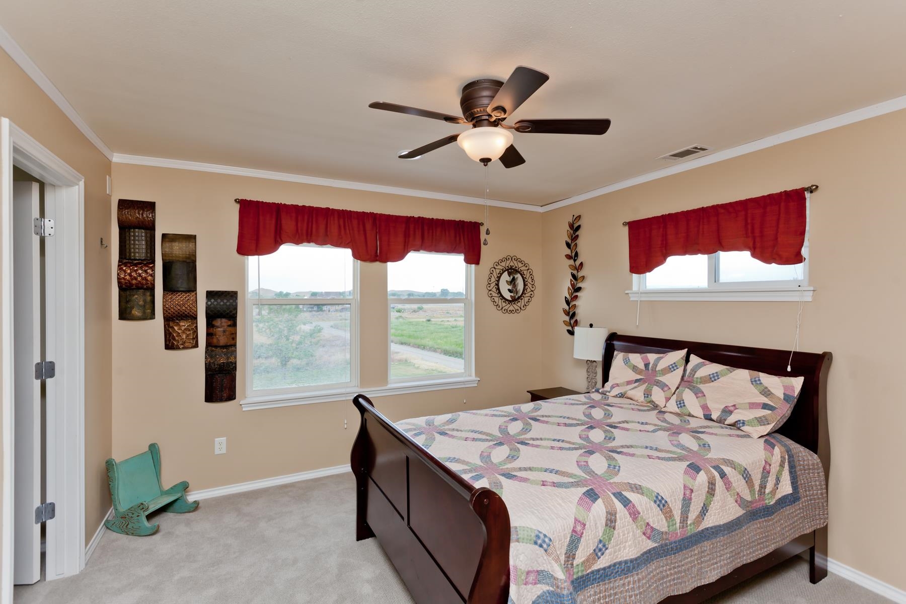 1815 O Road Fruita, CO 81521 - Photo 32 of 42 a bed sitting in a bedroom next to a window