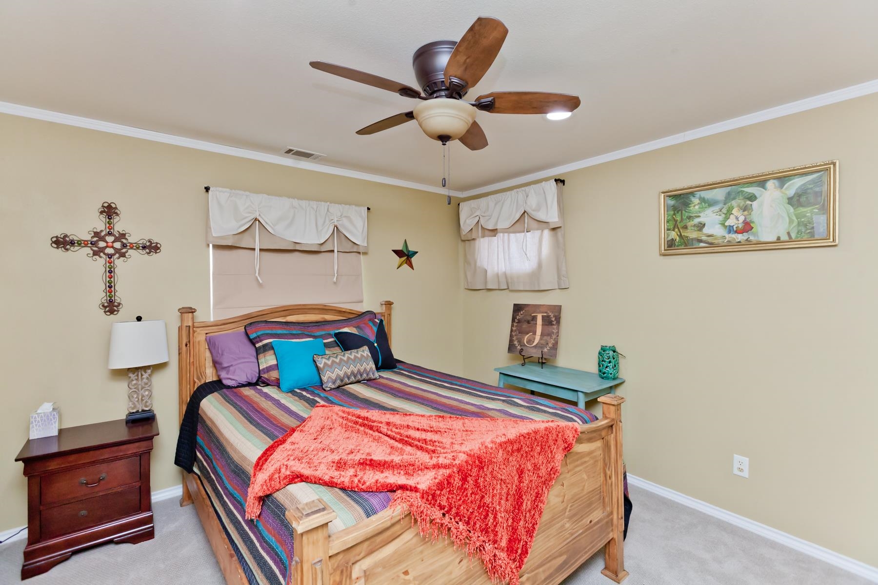 1815 O Road Fruita, CO 81521 - Photo 34 of 42 a bedroom with bed and a chandelier