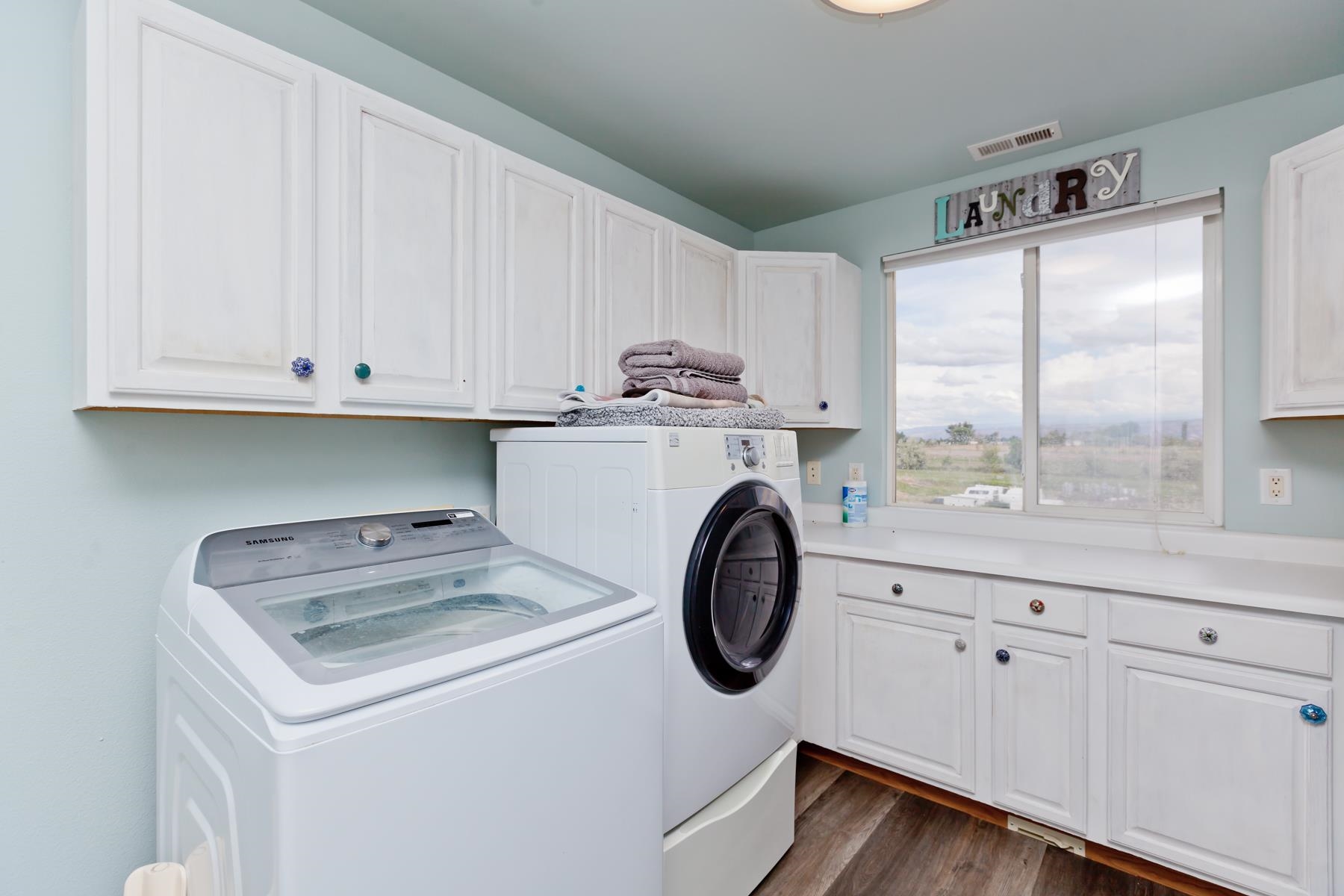 1815 O Road Fruita, CO 81521 - Photo 38 of 42 a kitchen with a refrigerator and white cabinets