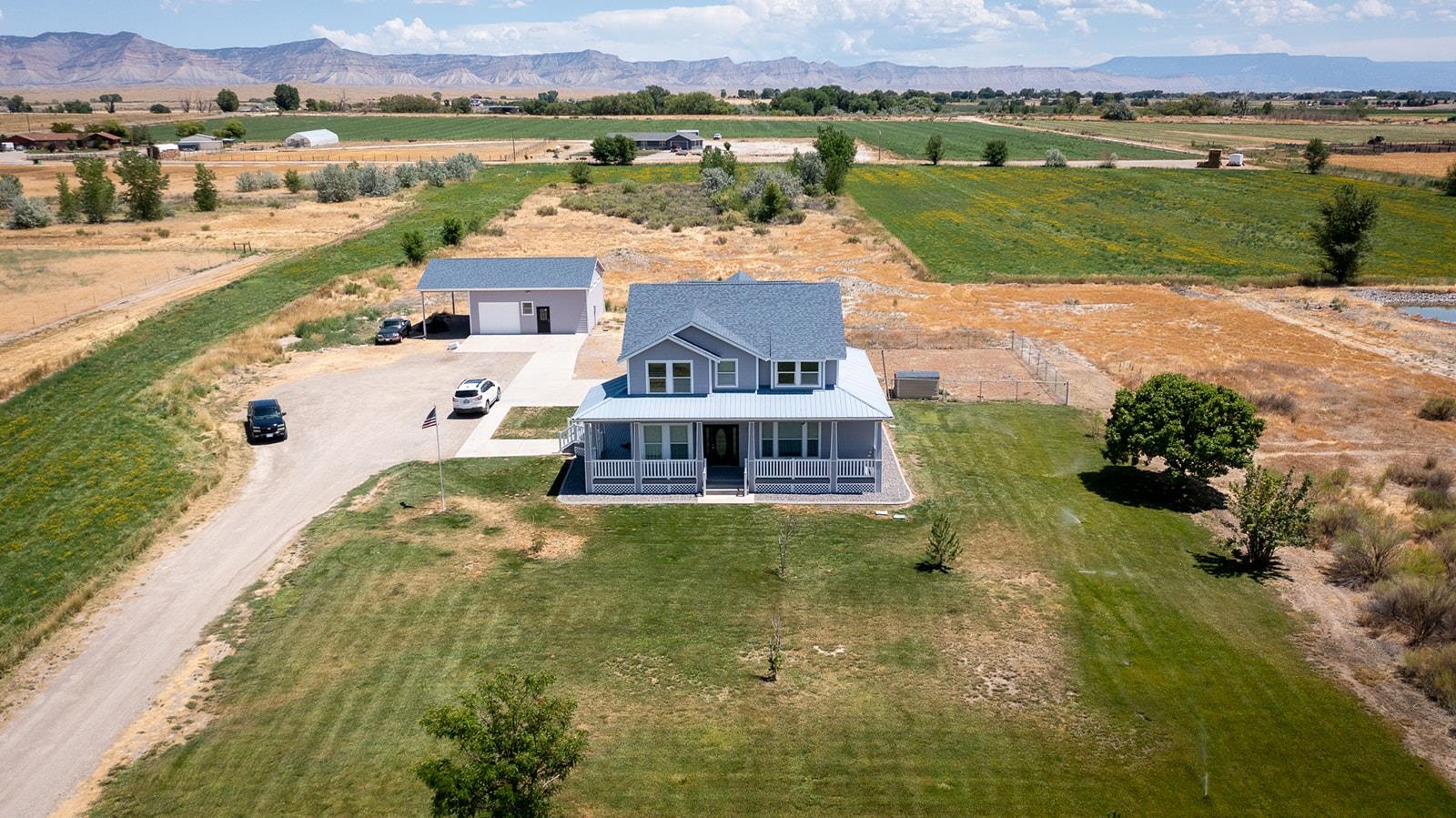 1815 O Road Fruita, CO 81521 - Photo 4 of 42 an aerial view of a house with a lake view