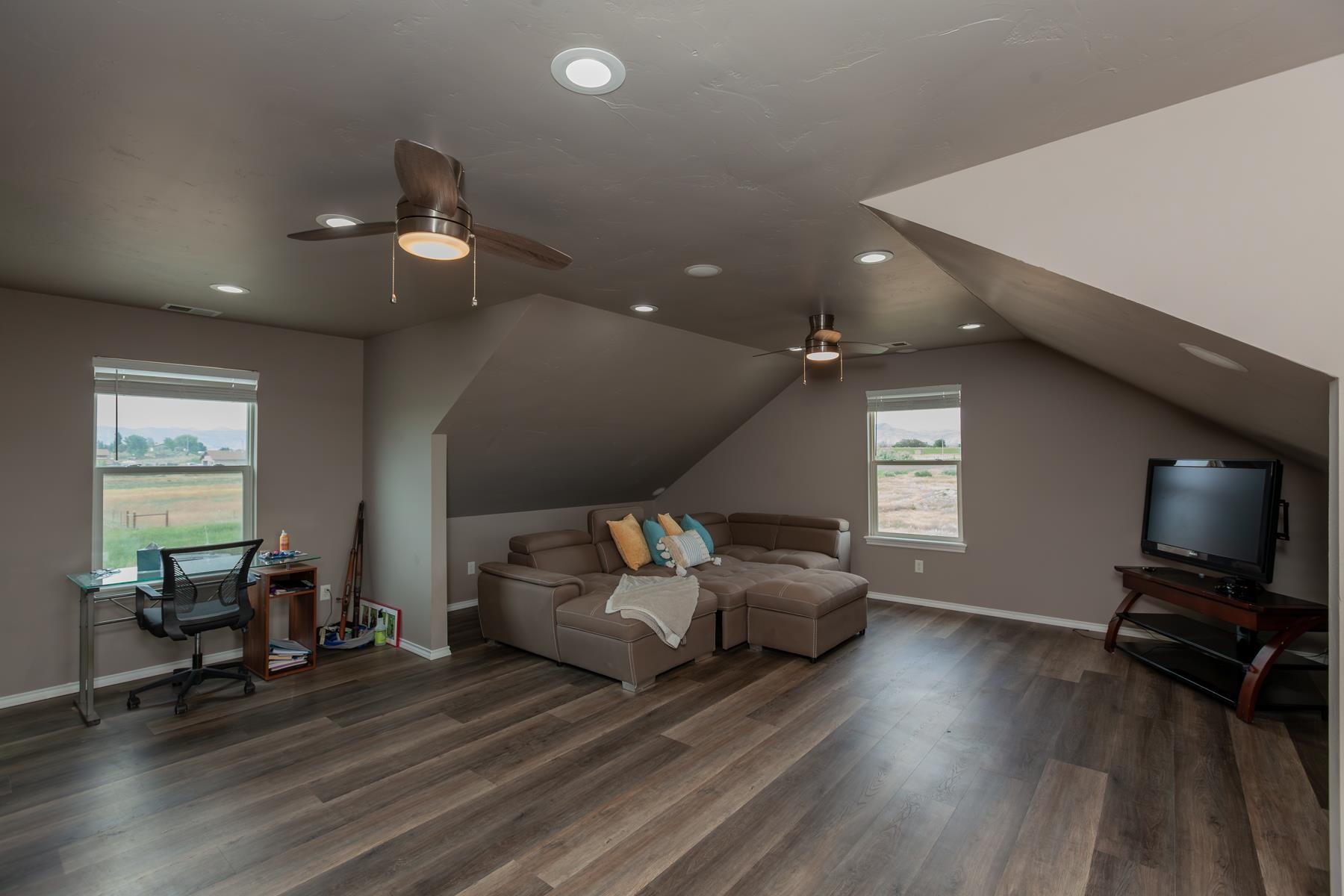 1815 O Road Fruita, CO 81521 - Photo 42 of 42 a living room with furniture and a flat screen tv