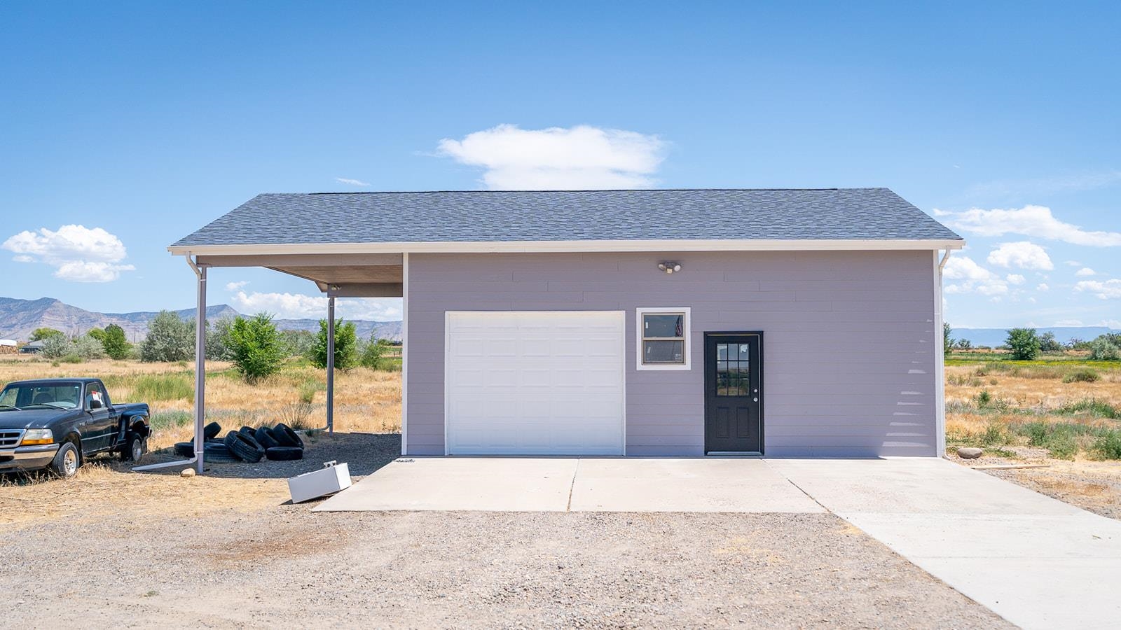 1815 O Road Fruita, CO 81521 - Photo 6 of 42 a front view of a house with a outdoor space