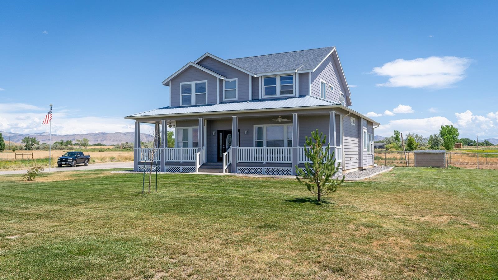 1815 O Road Fruita, CO 81521 - Photo 10 of 42 a view of a house with a yard and sitting area