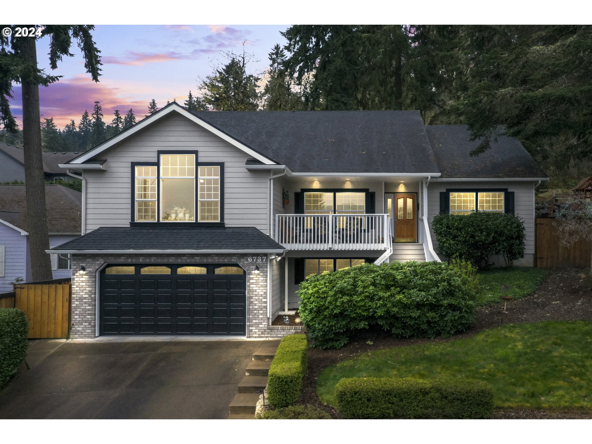 6737 Ivy Street Springfield, OR 97478 - Photo 1 of 48 a front view of a house with a yard