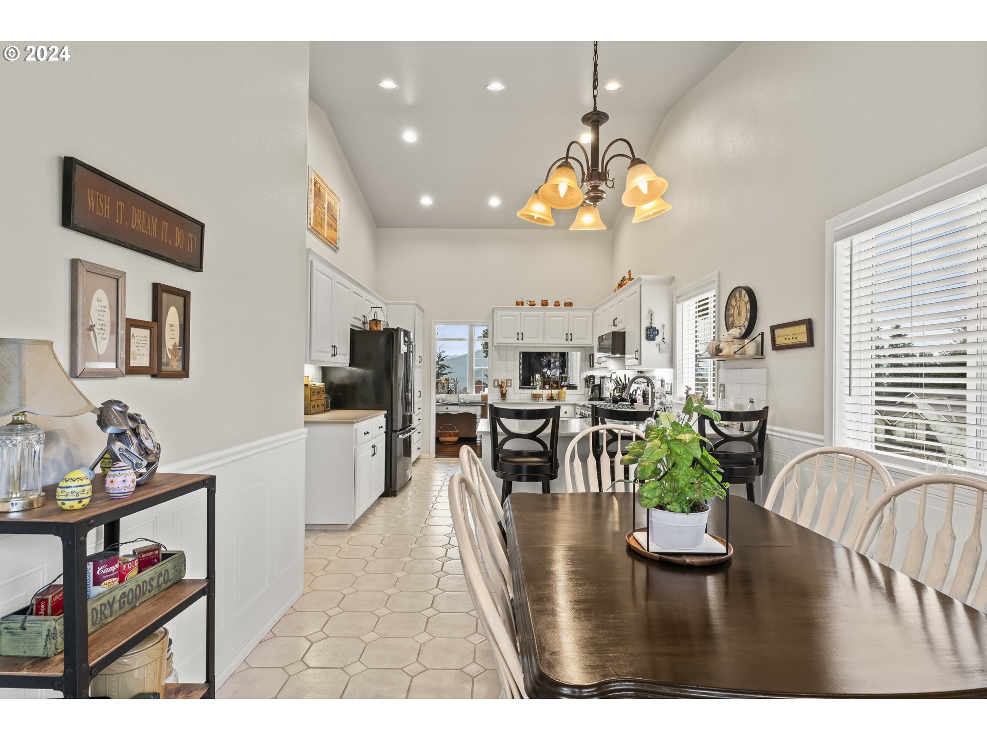6737 Ivy Street Springfield, OR 97478 - Photo 21 of 48 a living room with kitchen island furniture and a chandelier