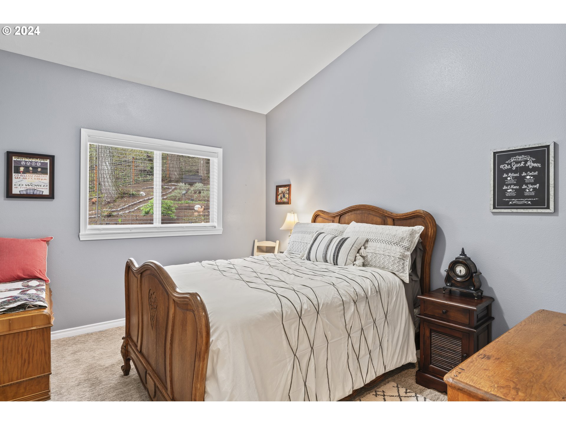 6737 Ivy Street Springfield, OR 97478 - Photo 25 of 48 a bedroom with a bed and a lamp with window