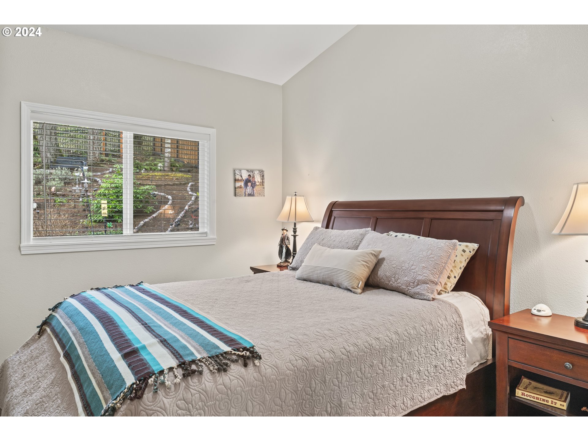 6737 Ivy Street Springfield, OR 97478 - Photo 29 of 48 a bedroom with a bed and wooden floor