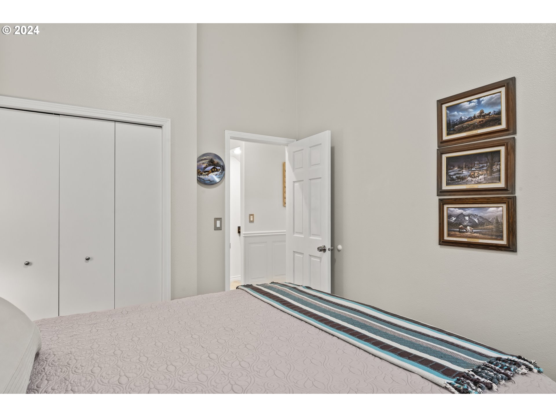 6737 Ivy Street Springfield, OR 97478 - Photo 30 of 48 a bedroom with a bed and a painting on the wall