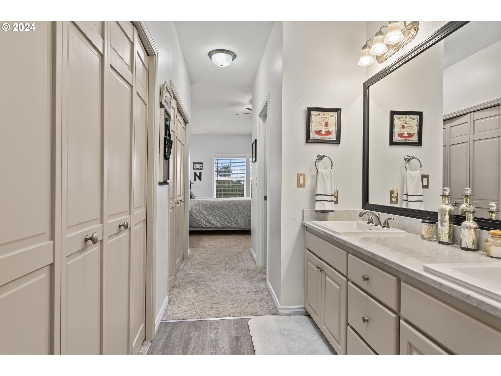 6737 Ivy Street Springfield, OR 97478 - Photo 38 of 48 a spacious bathroom with a double vanity sink and a mirror