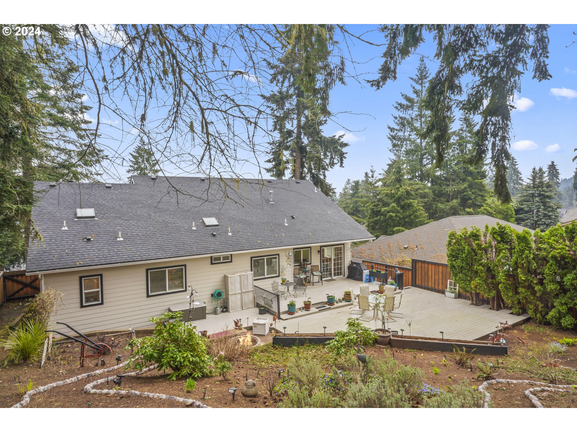 6737 Ivy Street Springfield, OR 97478 - Photo 48 of 48 a view of house with yard and trees in the background