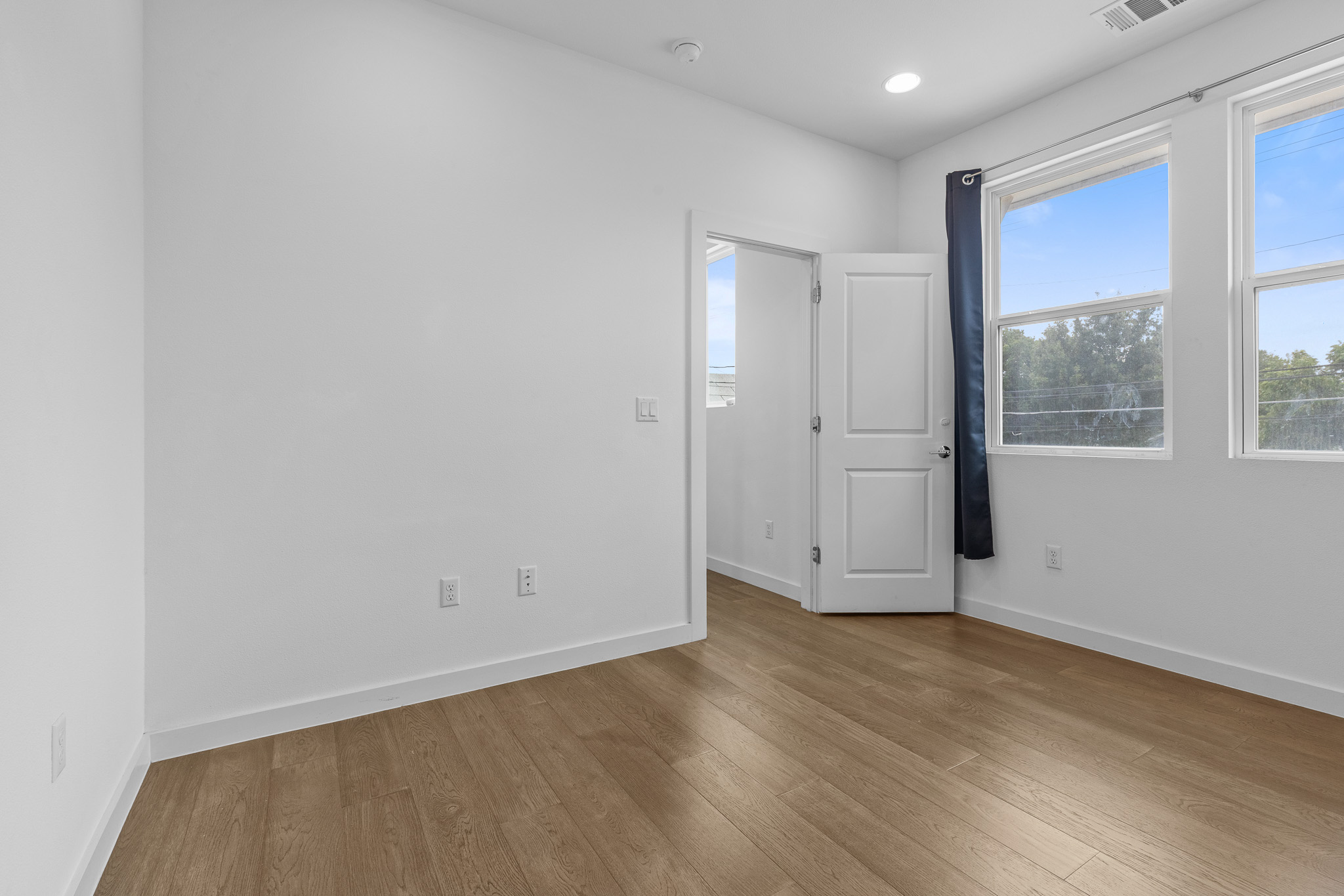 2604 Wheless Lane, Unit 1 Austin, TX 78723 - Photo 19 of 38 High ceilings and window placement maximize the feeling of openness and airiness.