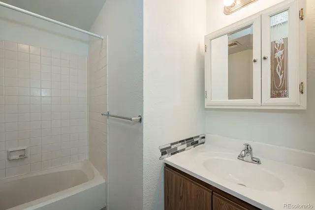 a bathroom with a sink and a bathtub