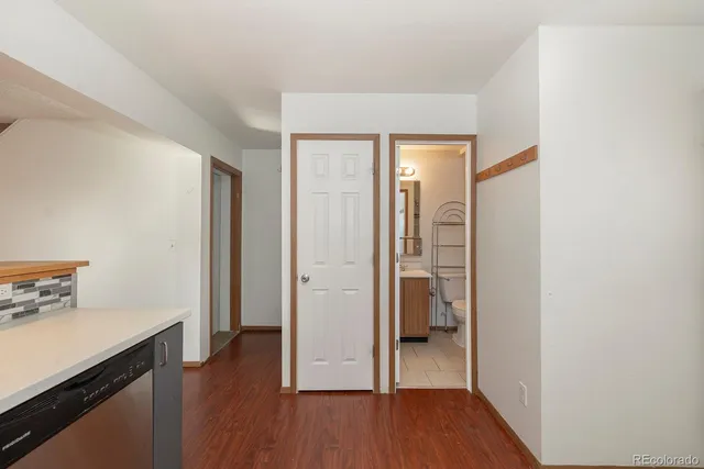 a view of room with wooden floor