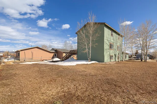 a view of a house with a snow in the yard