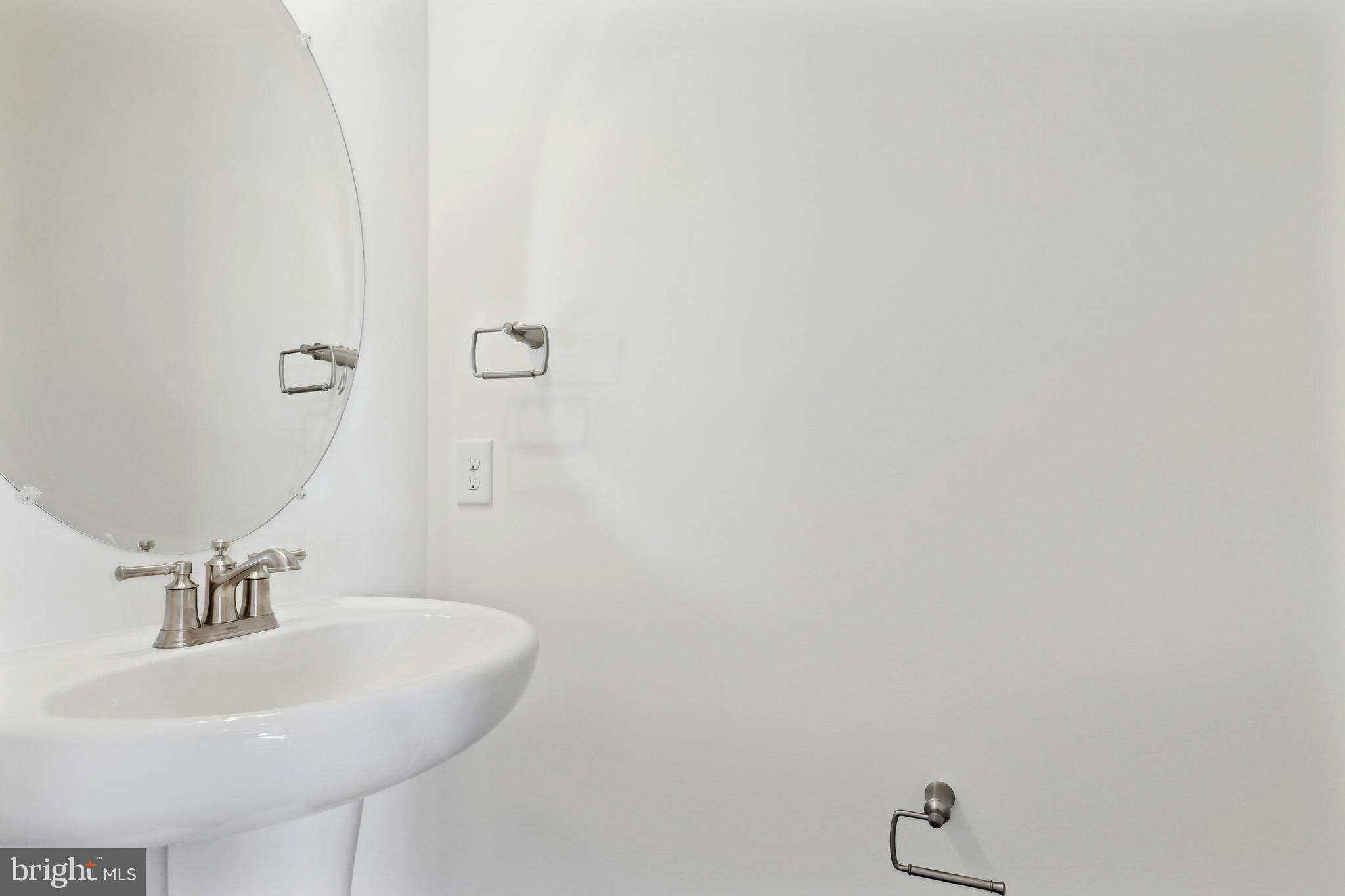 65 Eagle Drive Hanover, PA 17331 - Photo 13 of 26 a bathroom with a sink and mirror