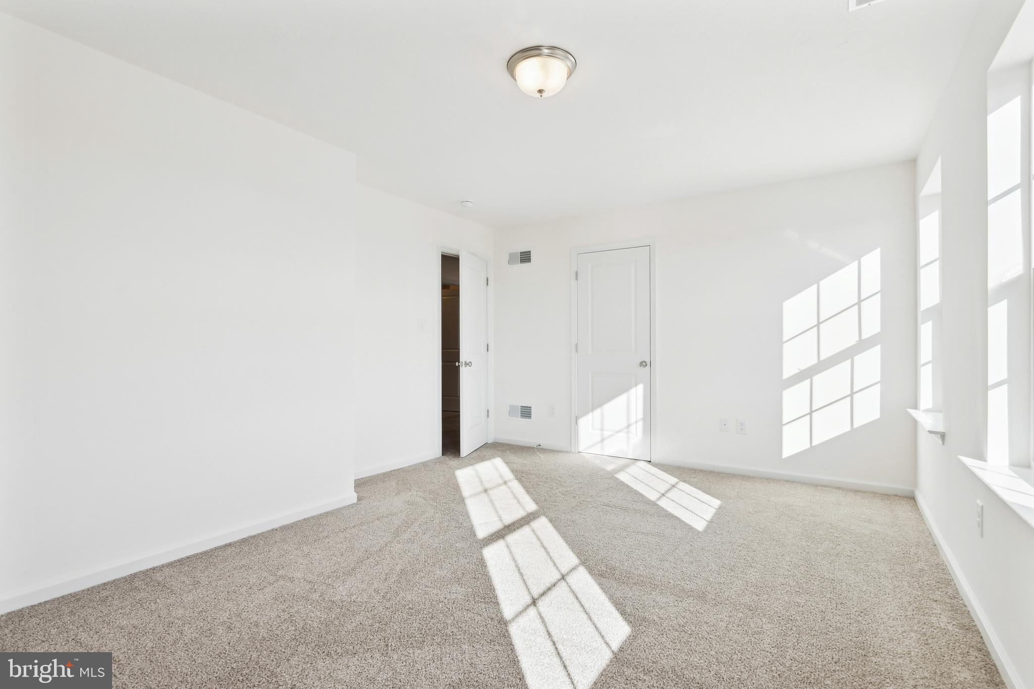 65 Eagle Drive Hanover, PA 17331 - Photo 22 of 26 a spacious bedroom with a large bed and a window