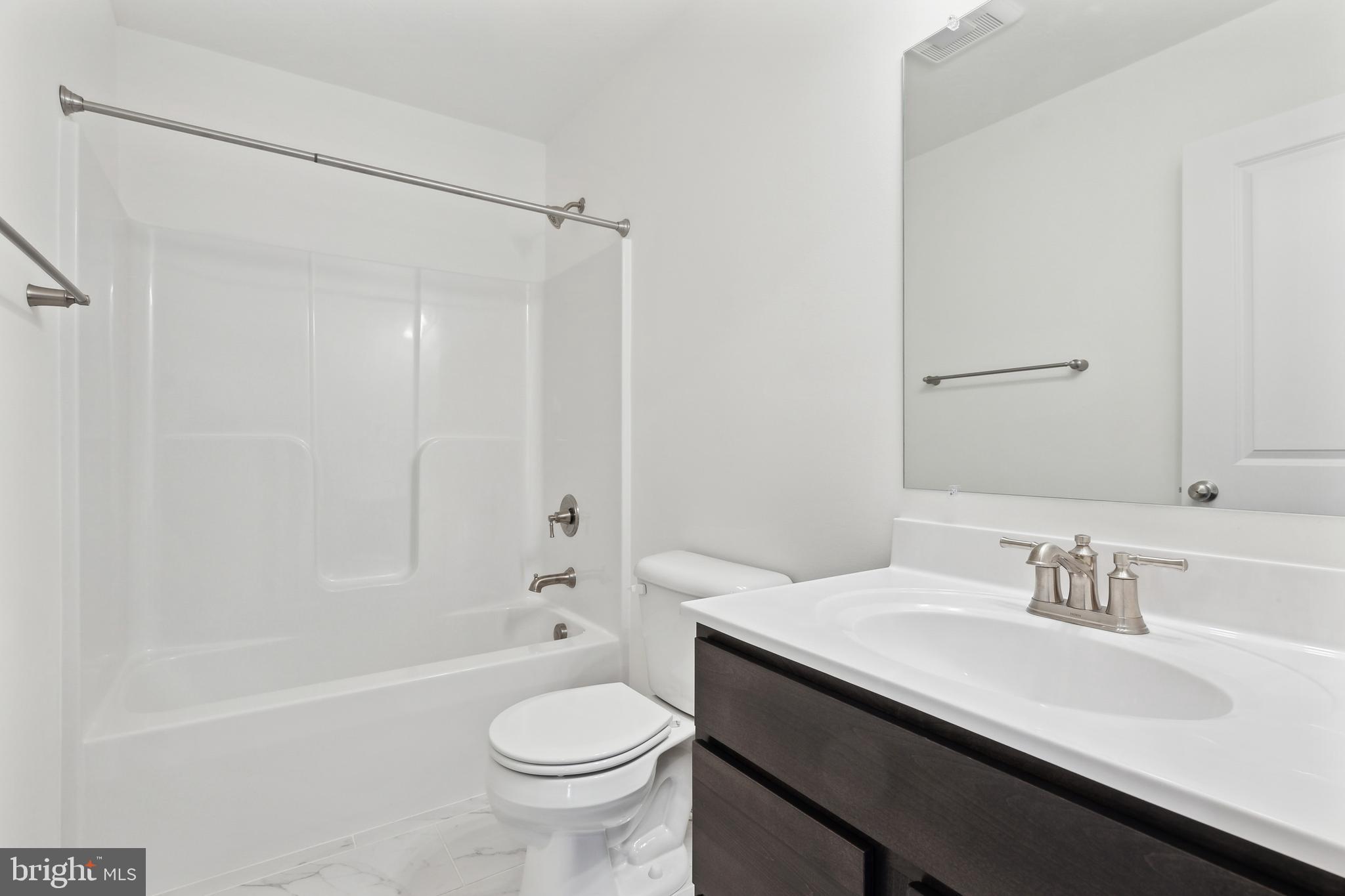 65 Eagle Drive Hanover, PA 17331 - Photo 25 of 26 a bathroom with a sink a toilet and a bathtub