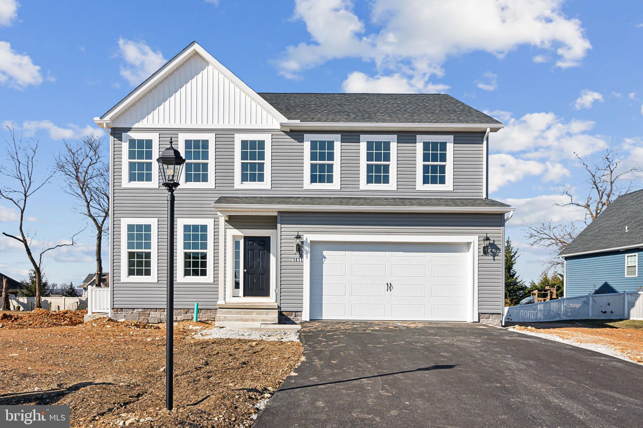 65 Eagle Drive Hanover, PA 17331 - Photo 4 of 26 a front view of a house with a yard and garage
