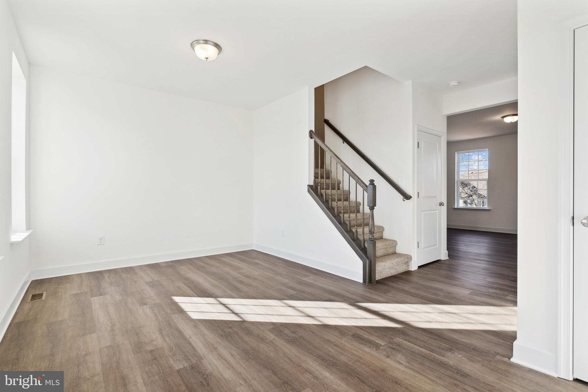 65 Eagle Drive Hanover, PA 17331 - Photo 5 of 26 a view of a hallway with wooden floor and staircase