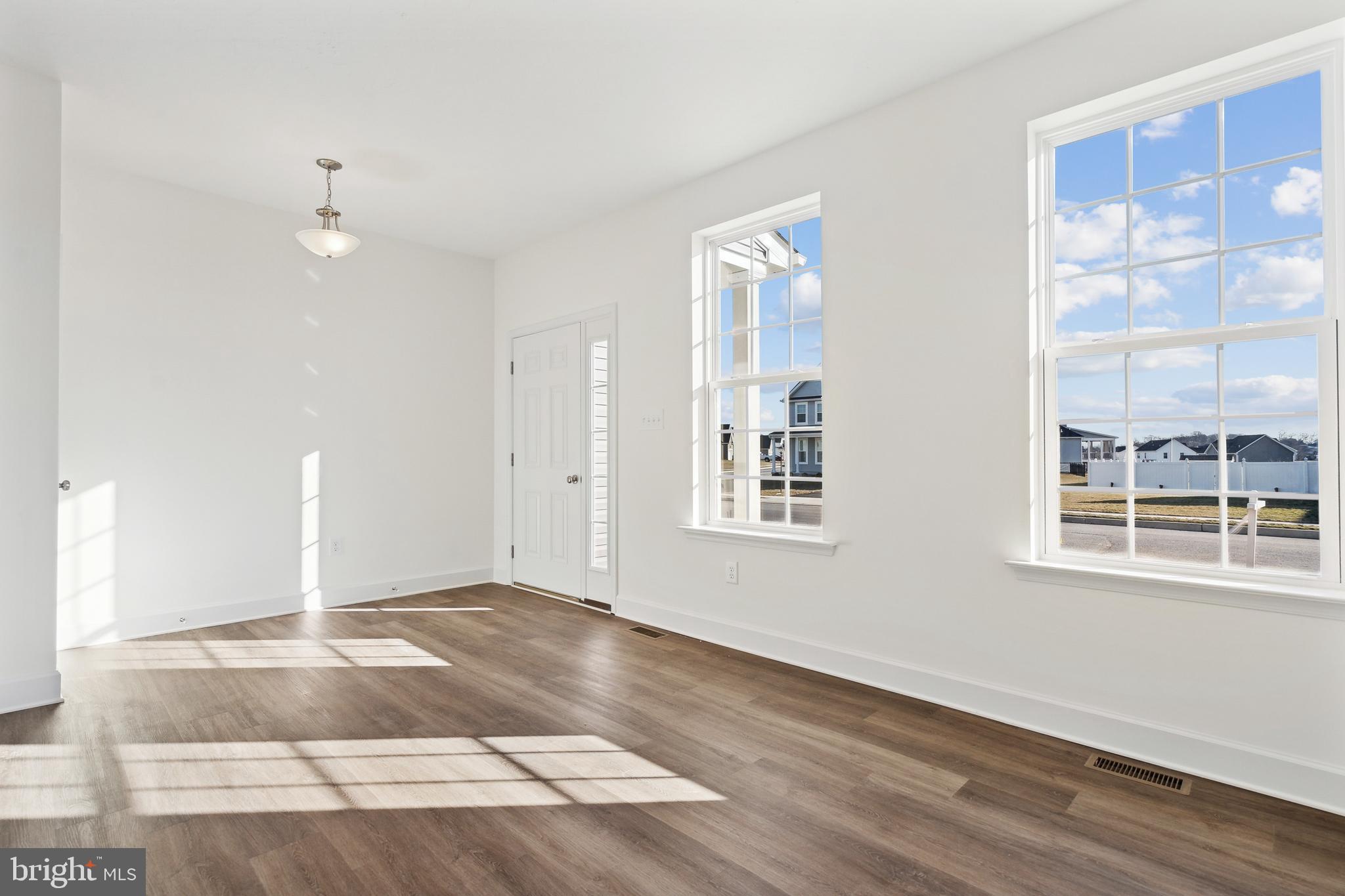 65 Eagle Drive Hanover, PA 17331 - Photo 6 of 26 an empty room with wooden floor and windows