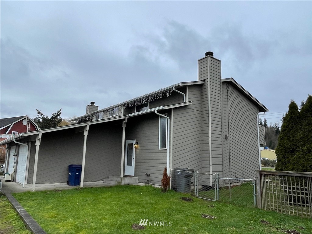 330 3rd Place Southwest Pacific, WA 98047 - Photo 1 of 1 a front view of a house with garden