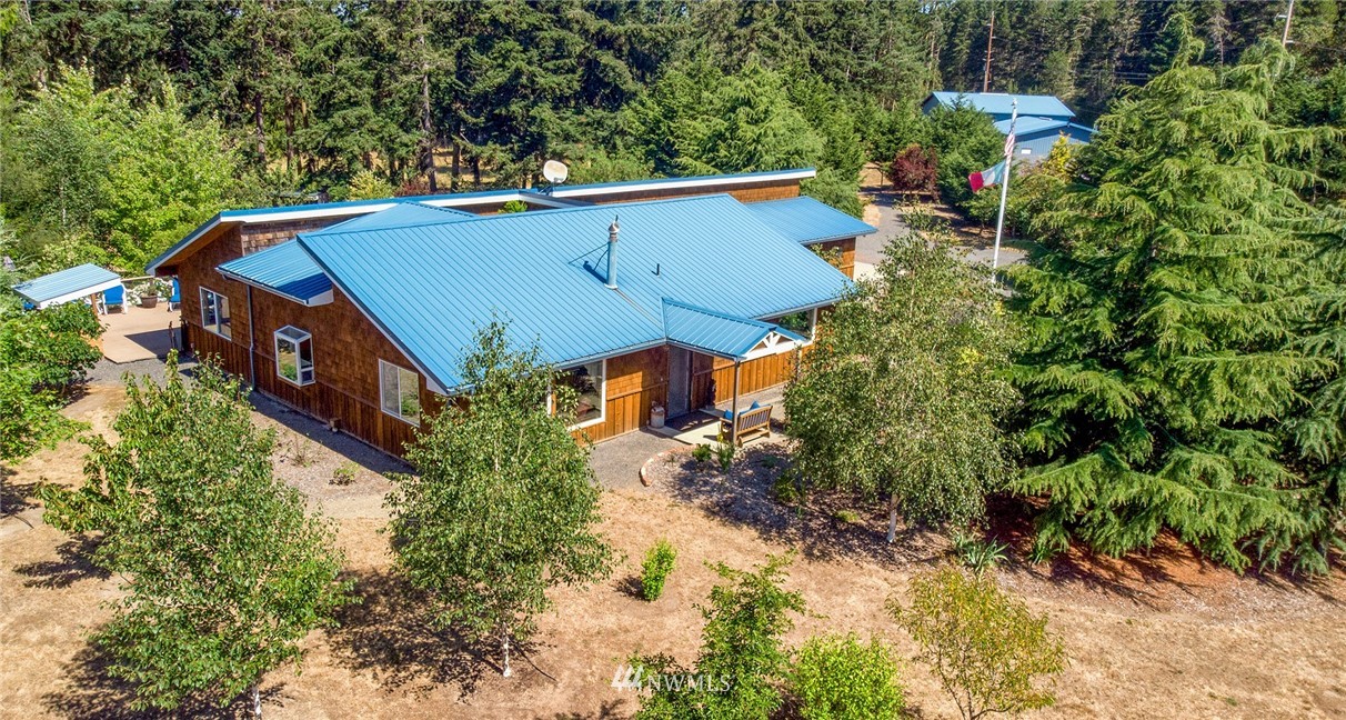 1976 Center Road Lopez Island, WA 98261 - Photo 1 of 26 a view of a house with a yard