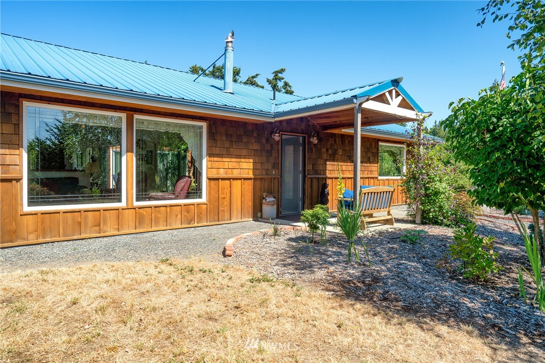 1976 Center Road Lopez Island, WA 98261 - Photo 2 of 26 a view of a house with a porch