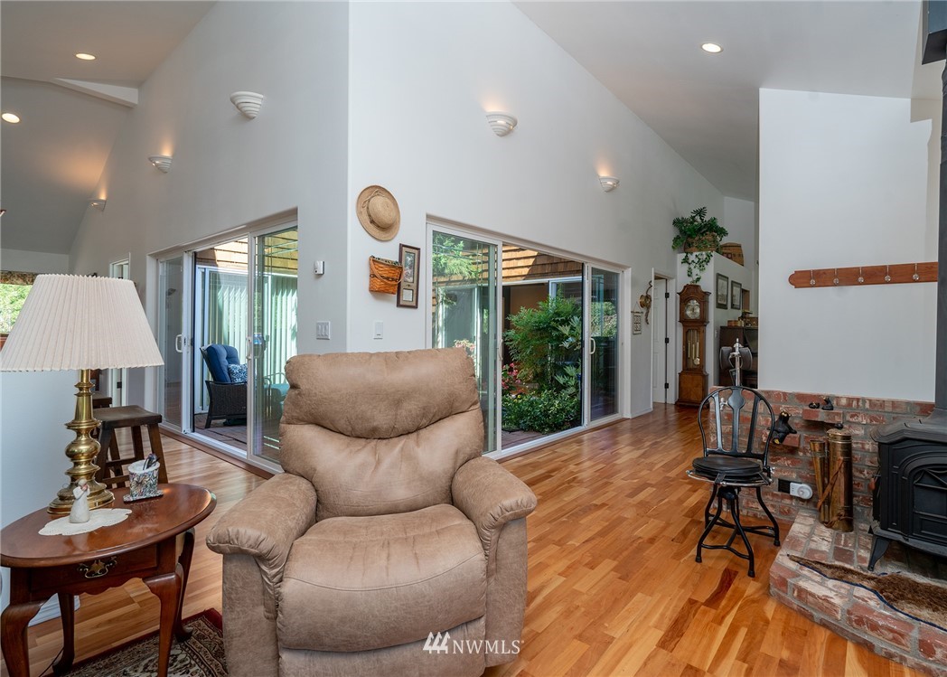 1976 Center Road Lopez Island, WA 98261 - Photo 11 of 26 a living room with furniture and a wooden floor