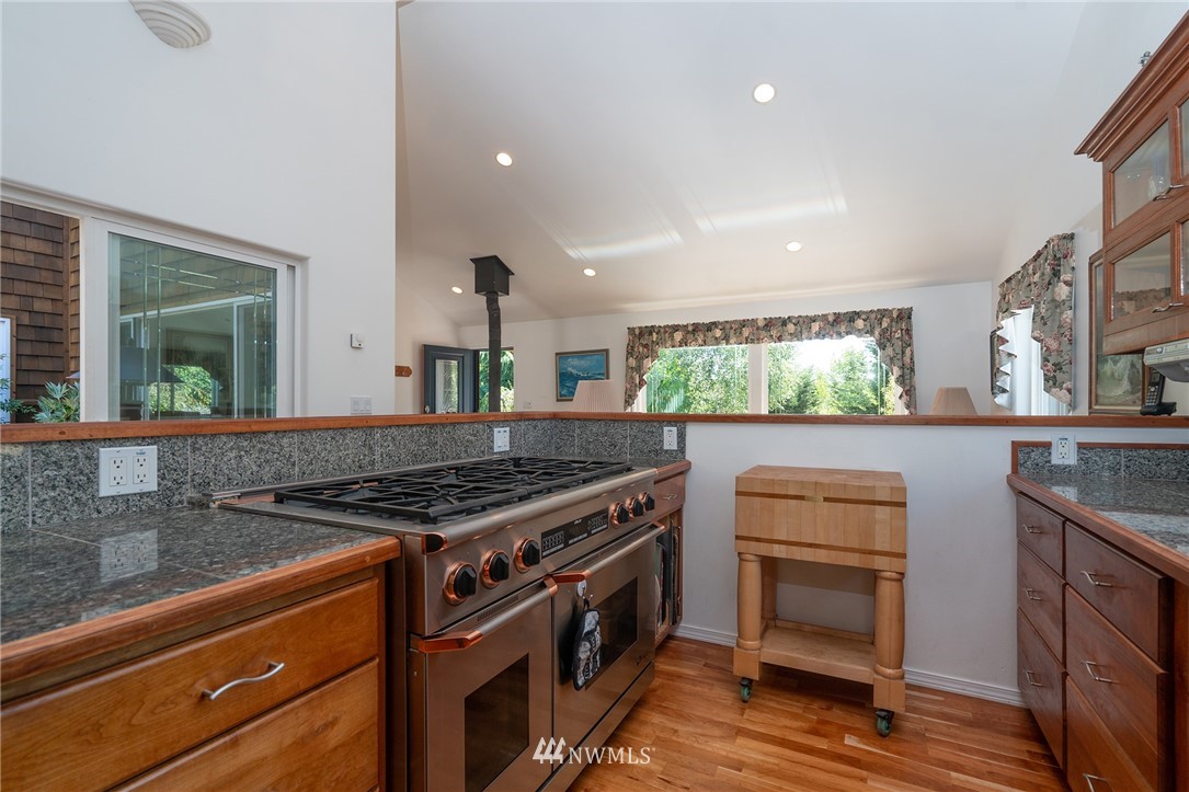1976 Center Road Lopez Island, WA 98261 - Photo 14 of 26 a kitchen with stainless steel appliances granite countertop a stove and a sink