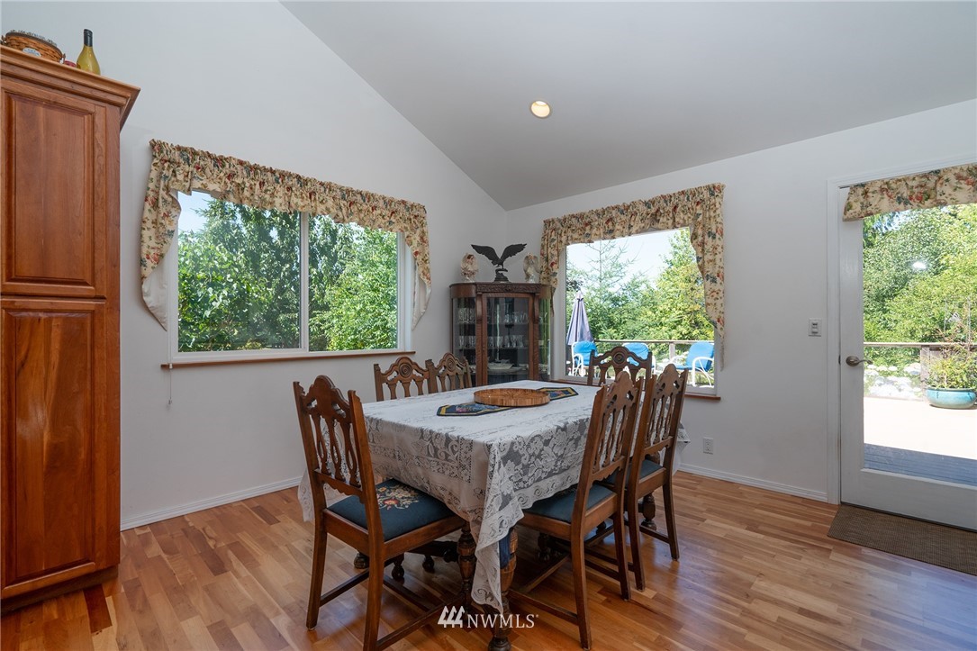1976 Center Road Lopez Island, WA 98261 - Photo 15 of 26 a dining room with furniture window and wooden floor