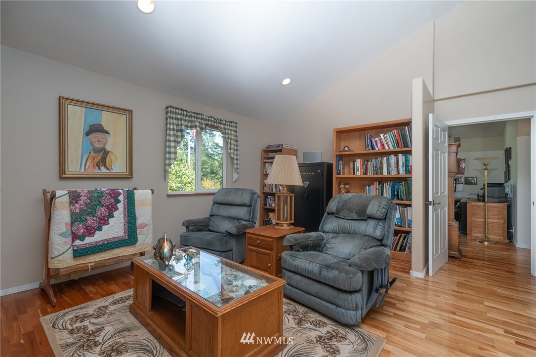 1976 Center Road Lopez Island, WA 98261 - Photo 18 of 26 a living room with furniture and painting on the wall with wooden floor