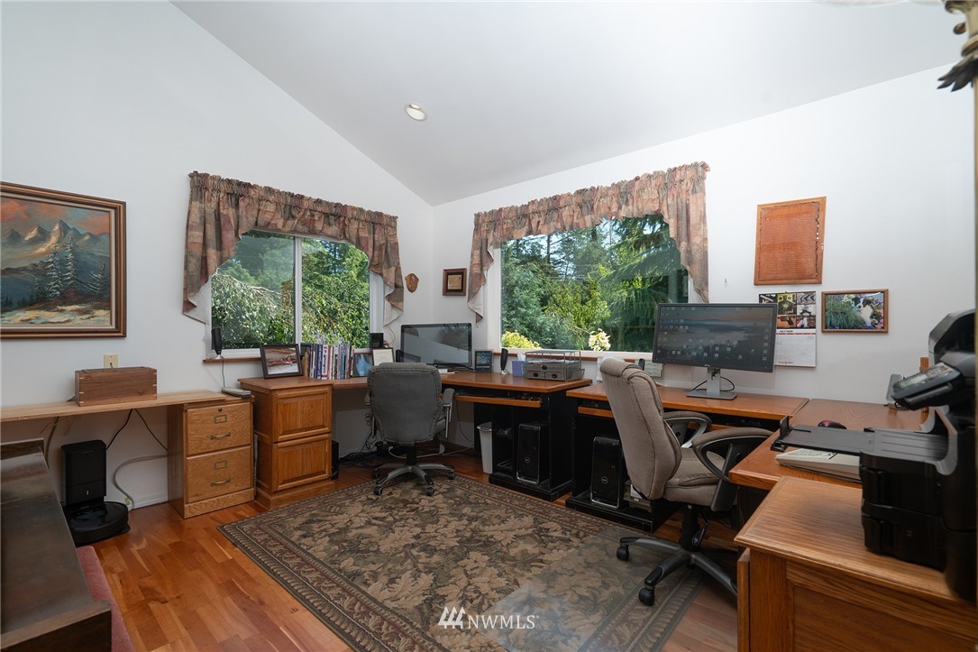 1976 Center Road Lopez Island, WA 98261 - Photo 20 of 26 a view of a workspace with furniture and a window