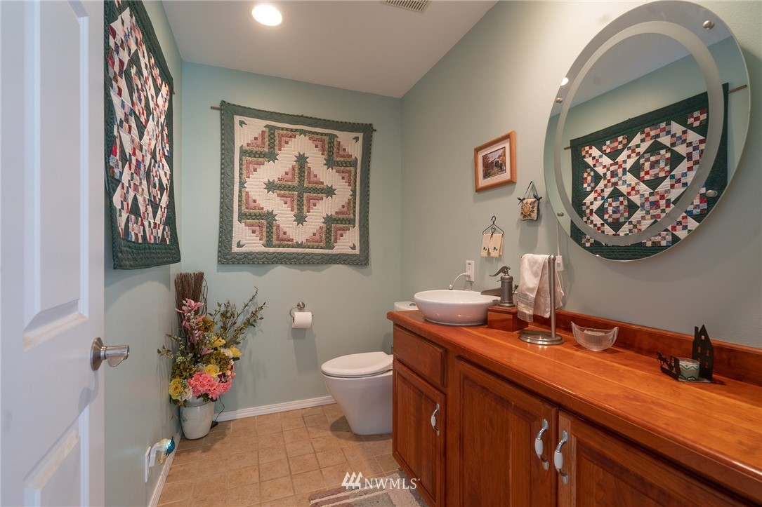 1976 Center Road Lopez Island, WA 98261 - Photo 21 of 26 a bathroom with a toilet sink and mirror