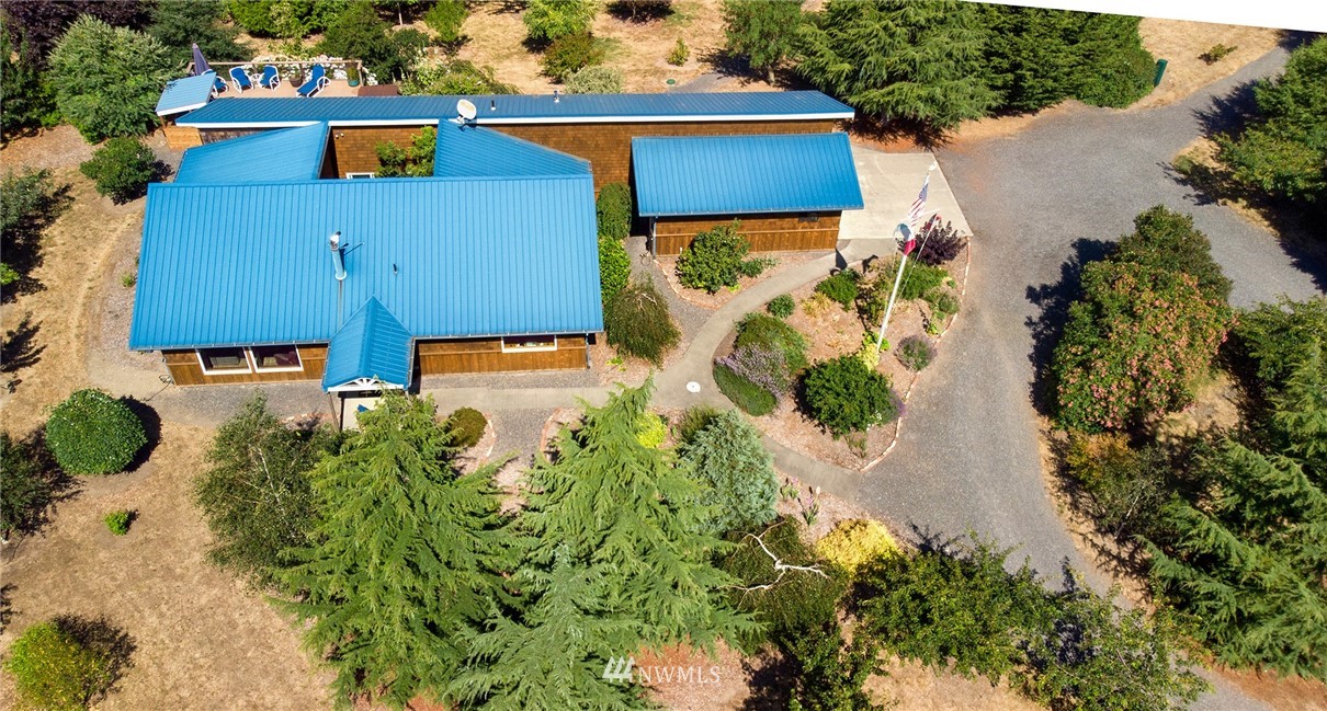 1976 Center Road Lopez Island, WA 98261 - Photo 24 of 26 an aerial view of a house with a yard and large trees